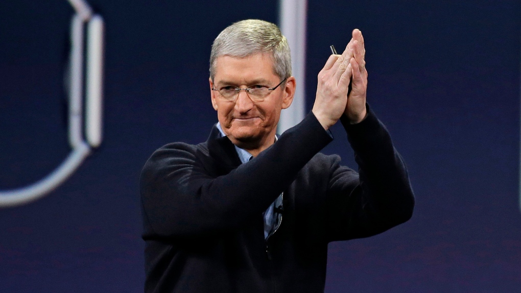 Apple CEO Tim Cook applauds