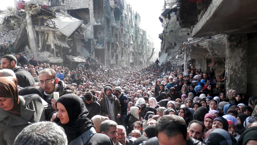 Syrian civilians look for their belongings