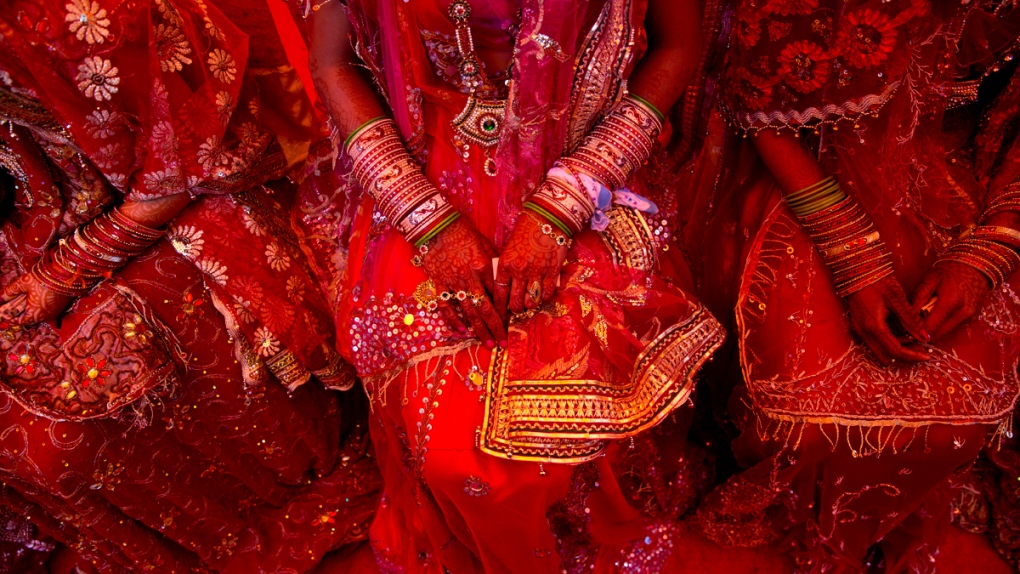 Indian brides dressed in wedding finery