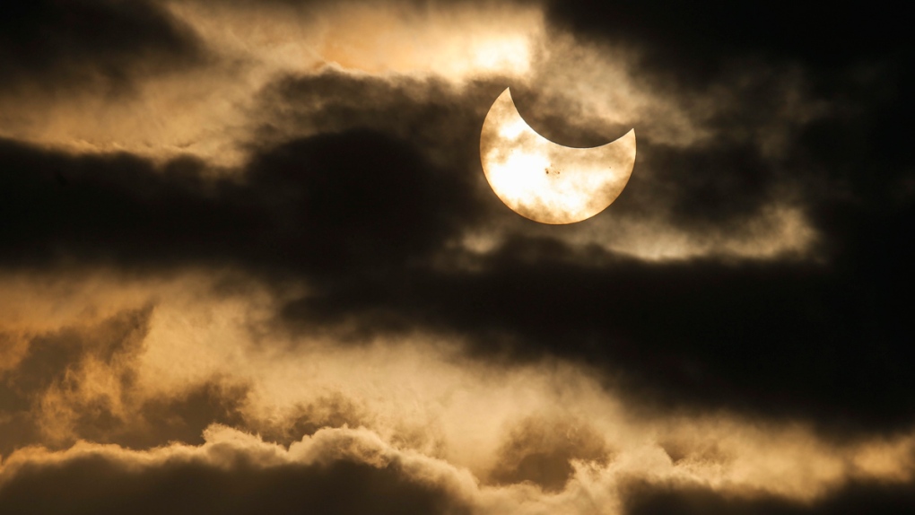 Partial solar eclipse is seen in Wichita, Kan.