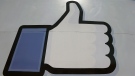This June 11, 2014 photo shows Facebook's 'like' symbol at the entrance to the company's campus in Menlo Park, Calif. (AP / Jeff Chiu)