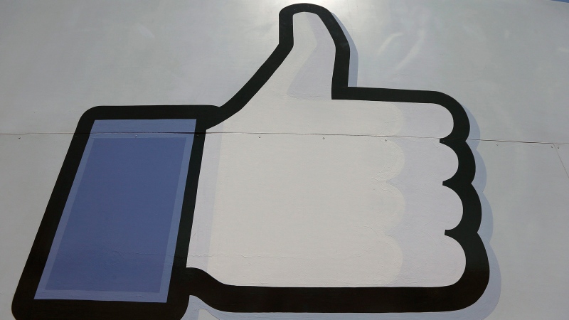 This June 11, 2014 photo shows Facebook's 'like' symbol at the entrance to the company's campus in Menlo Park, Calif. (AP / Jeff Chiu)