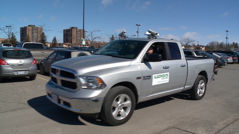 A truck decked out with license plate recognition cameras patrols a parking lot at Algonquin College, Mar. 18. 2015