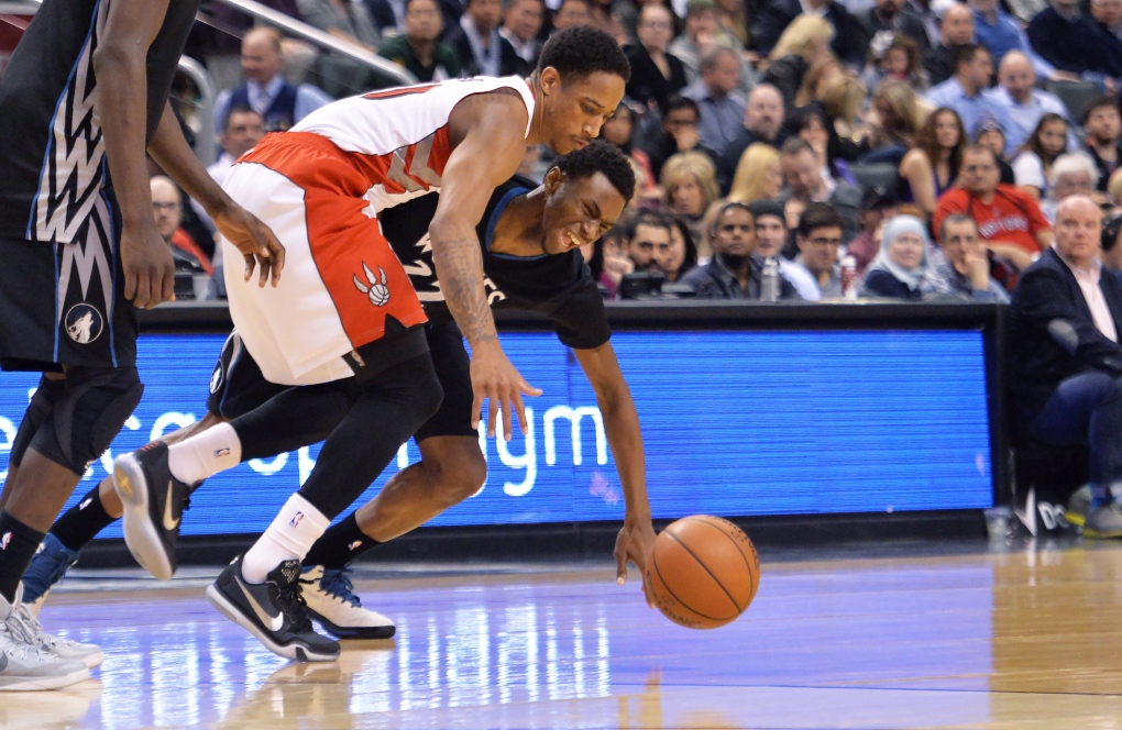 Toronto Raptors' DeMar DeRozan (10) gets fouled by Minnesota Timberwolves'  Andrew Wiggins (22) during the first