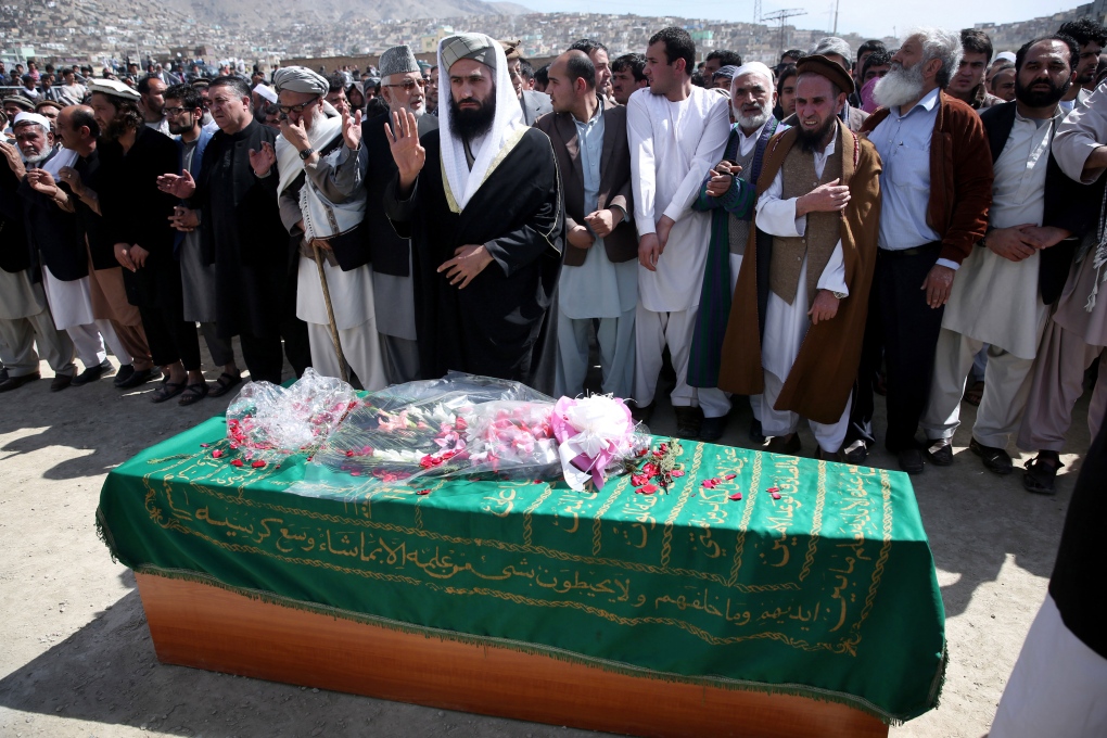 Afghan woman beaten to death by Kabul mob buried