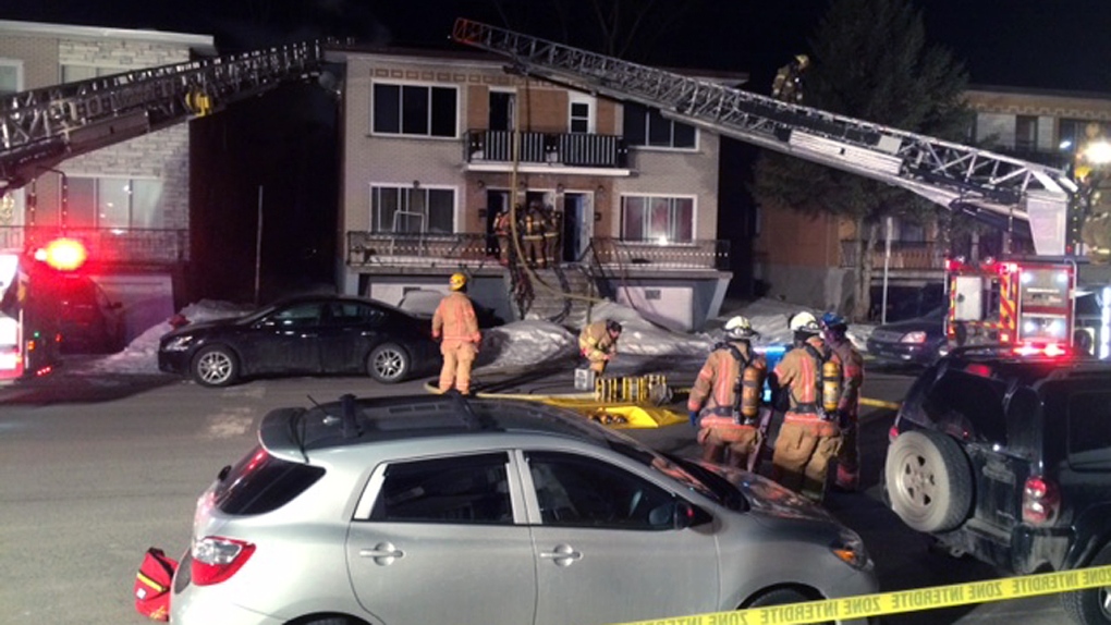 Firefighters extinguish a house fire on John F. Ke