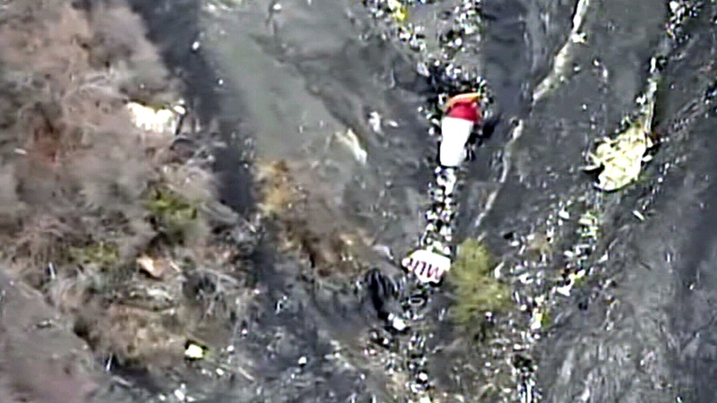Aerial view over the crash scene shows the wreckage of Germanwings Flight 9525 over the French Alps, Tuesday, March 24, 2015.