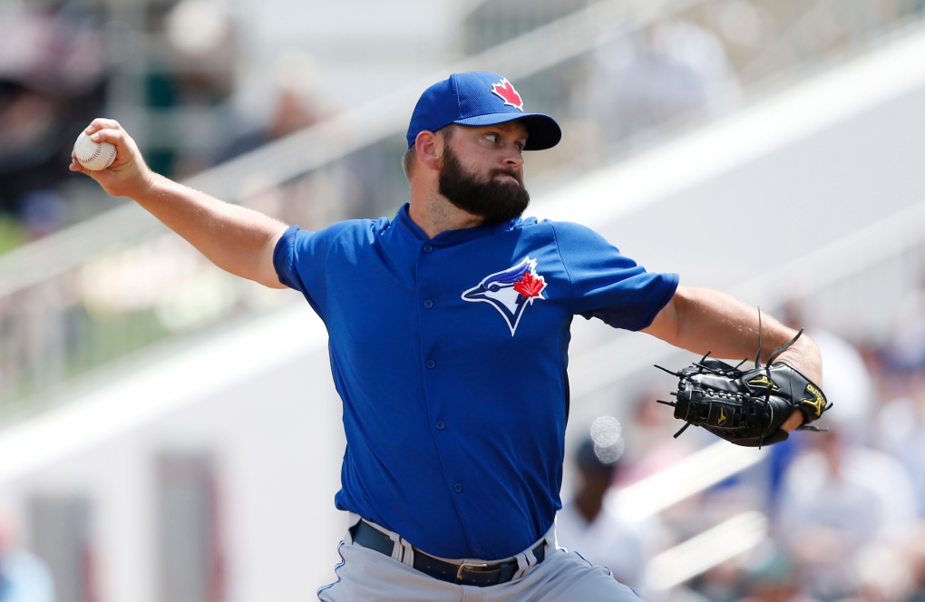 Todd Redmond pitches at Jays spring training 