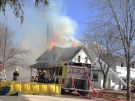 Firefighters battle a house fire on Perth Road 147 near Atwood, Ont., on Wednesday, April 1, 2015. (Kevin Doerr / CTV Kitchener)
