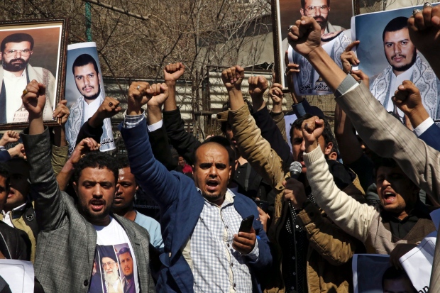 Yemeni men chant slogans