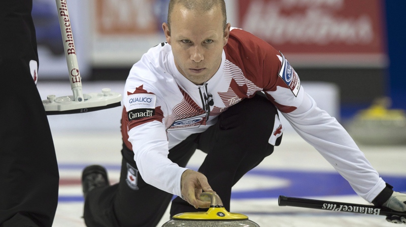 Team Canada skip Pat Simmons releases a rock in playoff action against Sweden at the men's world curling championships in Halifax on Saturday, April 4, 2015. THE CANADIAN PRESS/Andrew Vaughan