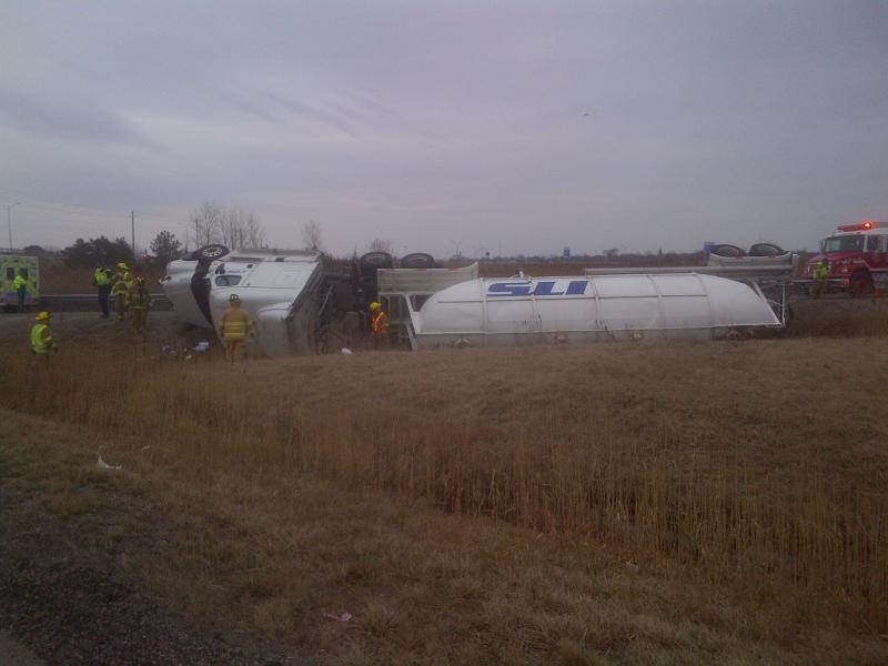 A transport truck rolled onto its side on Highway 401in Lakeshore, Ont. April 7, 2015. (Courtesy Essex County OPP)