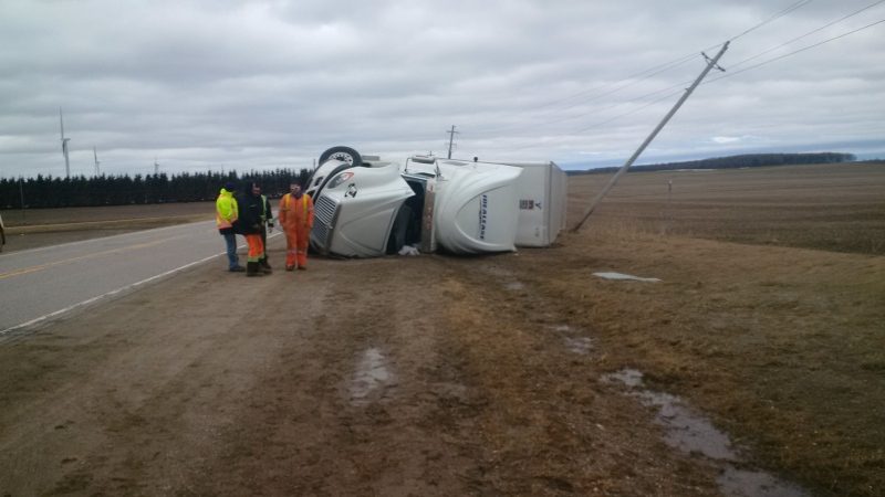 Police say a man was injured after a tractor trailer rolled north of Shelburne due to high winds on Friday, April 10, 2015. (Courtesy: OPP Constable Paul Nancekivell)