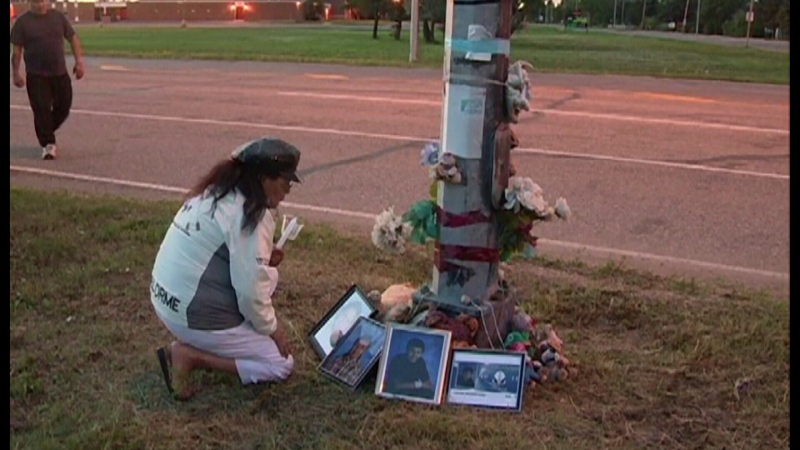 A woman attends the vigil for Yotin Ironstand in August 2013.  Ironstand was killed when he was hit by a car driven by Jason Ungar in July 2011. (File Footage)