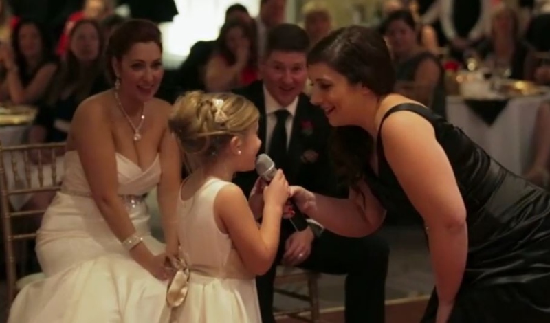 Seven-year-old Emma Coleman sings 'Love is an Open Door' with her mother is this image taken from YouTube video provided by Mitchell Reilly Productions.