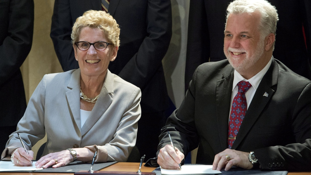 Wynne and Couillard sign environment agreement