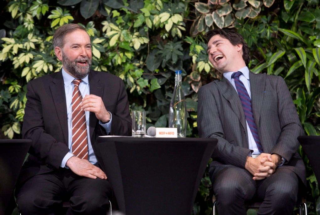 Justin Trudeau laughs with Tom Mulcair