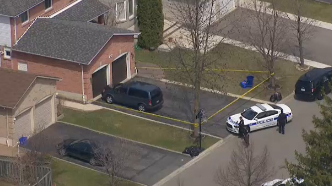 Police tape blocks off a home following a stabbing in Mississauga on Thursday, April 16, 2015. 
