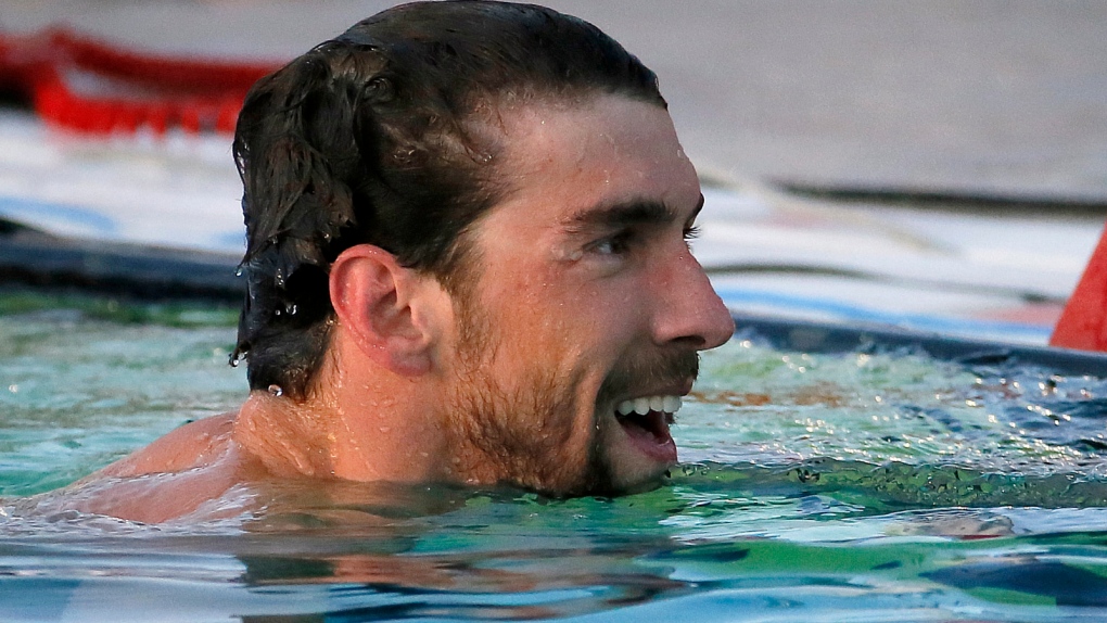 Michael Phelps wins after being away for months