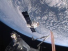 This image from NASA-TV shows the SpaceX Dragon-6 resupply capsule on Friday April 17, 2015 as it holds at the grapple point, 10 meters from the International Space Station as they cross over the Asia. (NASA-TV via AP)