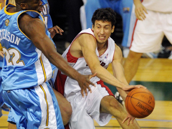 Toronto Raptors' Roko Ukic, right, makes a pass around Denver Nuggets forward Ruben Patterson (22) during the second half of preseason NBA action in Edmonton on Tuesday October 21, 2008. Denver beat Toronto 105-94. THE CANADIAN PRESS/Jimmy Jeong