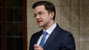 Minister of Employment and Social Development Pierre Poilievre answers a question during Question Period in the House of Commons in Ottawa on April 20, 2015. (Sean Kilpatrick / THE CANADIAN PRESS)