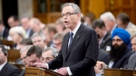 Finance Minister Joe Oliver tables the federal budget in the House of Commons in Ottawa on Tuesday, April 21, 2015. (Adrian Wyld / THE CANADIAN PRESS)
