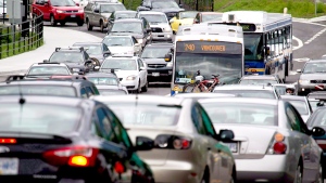 Motorists merge from four lanes into one as they enter the Lions Gate Bridge to drive into Vancouver, B.C., on July 15, 2011. A new census release from Statistics Canada Wednesday is expected to shed light on how people got to work last year, and what kind of jobs they were doing. (Darryl Dyck / THE CANADIAN PRESS)