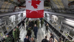 Members of the media and the Canadian Forces tour Canada's brand new CC-17 Globemaster III plane at CFB Trenton in Trenton, Ont., on Monday, March 30, 2015. (THE CANADIAN PRESS/Lars Hagberg)