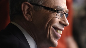 Joe Oliver takes part in a TV interview after tabling the federal budget in the House of Common on Parliament Hill in Ottawa on Tuesday, April 21, 2015. (Justin Tang / THE CANADIAN PRESS)