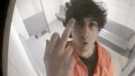 This photo released by the U.S. Attorney's office shows Dzhokhar Tsarnaev extending his middle finger to a security camera in his jail cell in Devens, Mass., on July 10, 2013.
