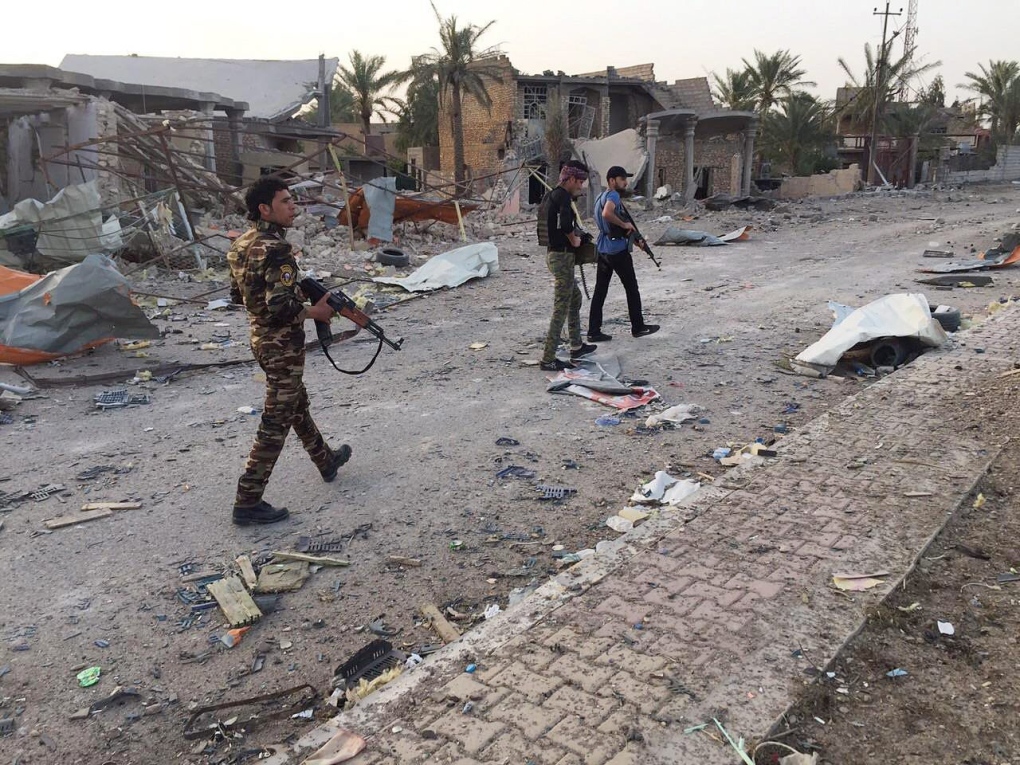 Iraqi security forces and tribal fighters