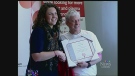 Brian Boyd is presented with a certificate after making his 1,000th blood donation in London, Ont. on Friday, April 24, 2015. (Reta Ismail / CTV London)