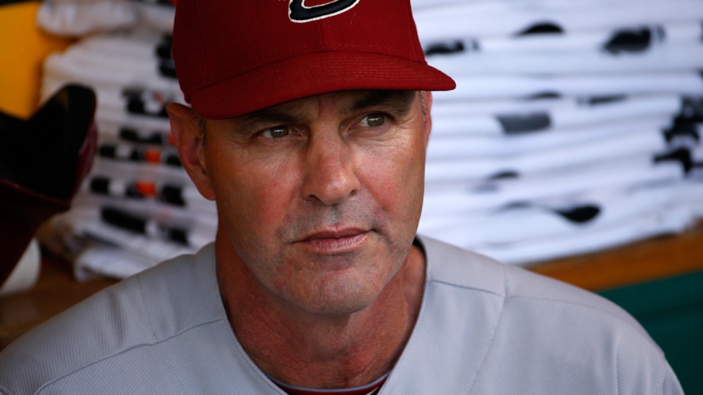 Kirk Gibson sits in the dugout