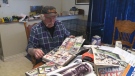 Archie Snively looks through his hockey card collection at his home in Wilsonville, Ont., on Friday, May 1, 2015.