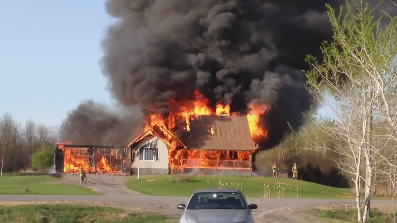 Firefighters battle a massive blaze on Fairhurst Drive near Kemptville, Ont. on Wednesday, May 6, 2015. (Brad Hardy/MyNews) 