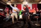 Then-Liberal leader Michael Ignatieff, left, gives the thumbs up after doing the hip flick game with comedian and self-proclaimed 'guerilla journalist' Nardwuar (a.k.a. John Ruskin) during a campaign stop in North Vancouver, B.C. on April 17, 2011. THE CANADIAN PRESS/Jonathan Hayward