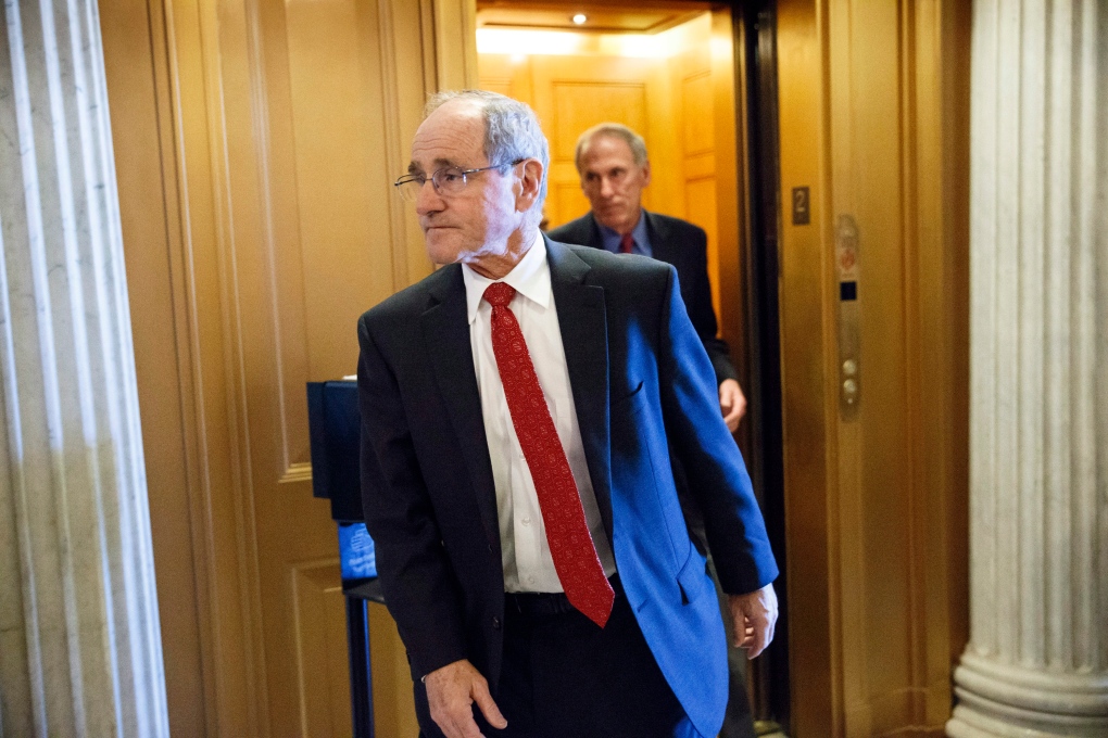 Senator James Risch steps out of elevator