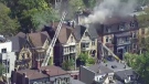 Firefighters work to extinguish a blaze in Toronto on Wednesday, May 20, 2015. 