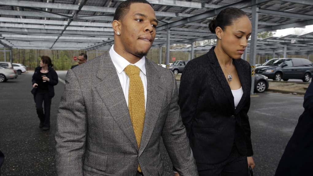 Ray Rice holds hands with his wife Janay Palmer