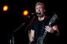 Guitarist and singer Chad Kroeger, of the Canadian rock band Nickelback, performs during the annual Rock in Rio music festival in Rio de Janeiro, Brazil, Friday, Sept. 20, 2013. (AP Photo/Silvia Izquierdo)