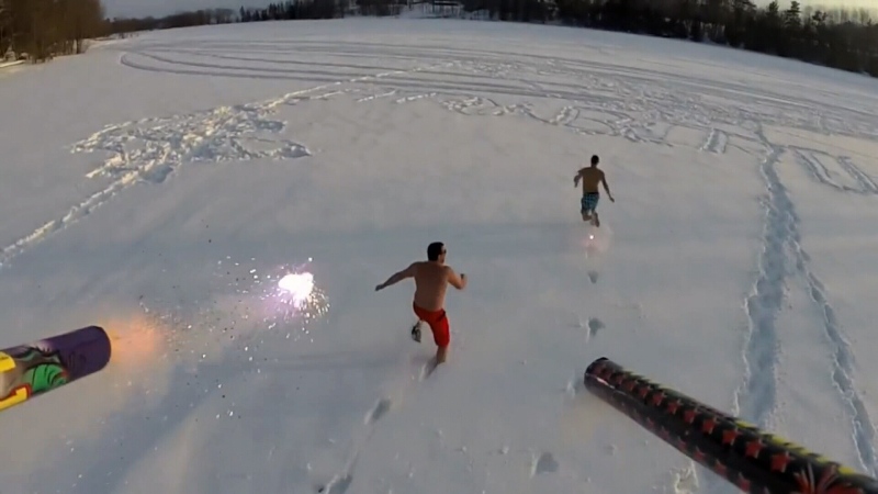 A drone outfitted with fireworks chases two men in Constance Bay, On. The video has gone viral. Source: YouTube / Andy Stewart