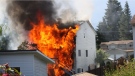 The home was rocked by explosions and was engulfed in flames. (Courtesy Comox Valley Record)