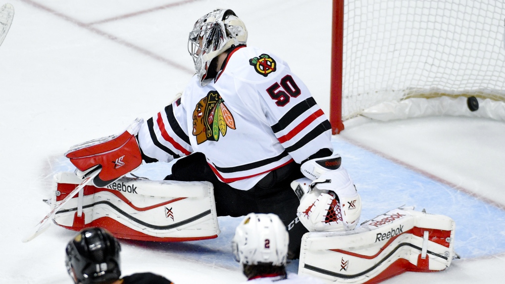 Corey Crawford lets in a goal