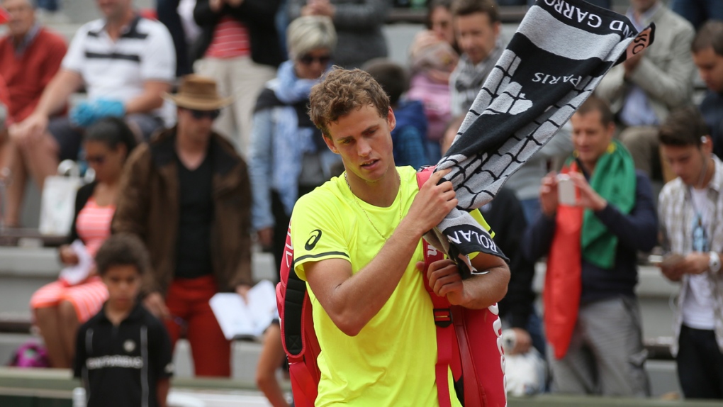 Vasek Pospisil leaves the court at the French Open