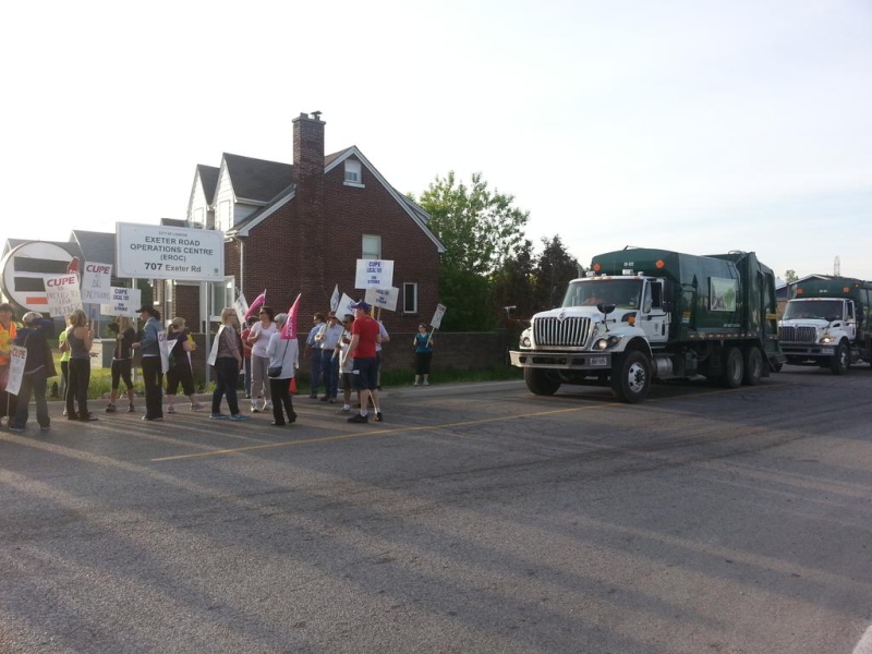 Striking inside workers delaying garbage trucks on Exeter Road in London, Ont. Tuesday, May 26, 2015. (Justin Zadorsky / CTV London)