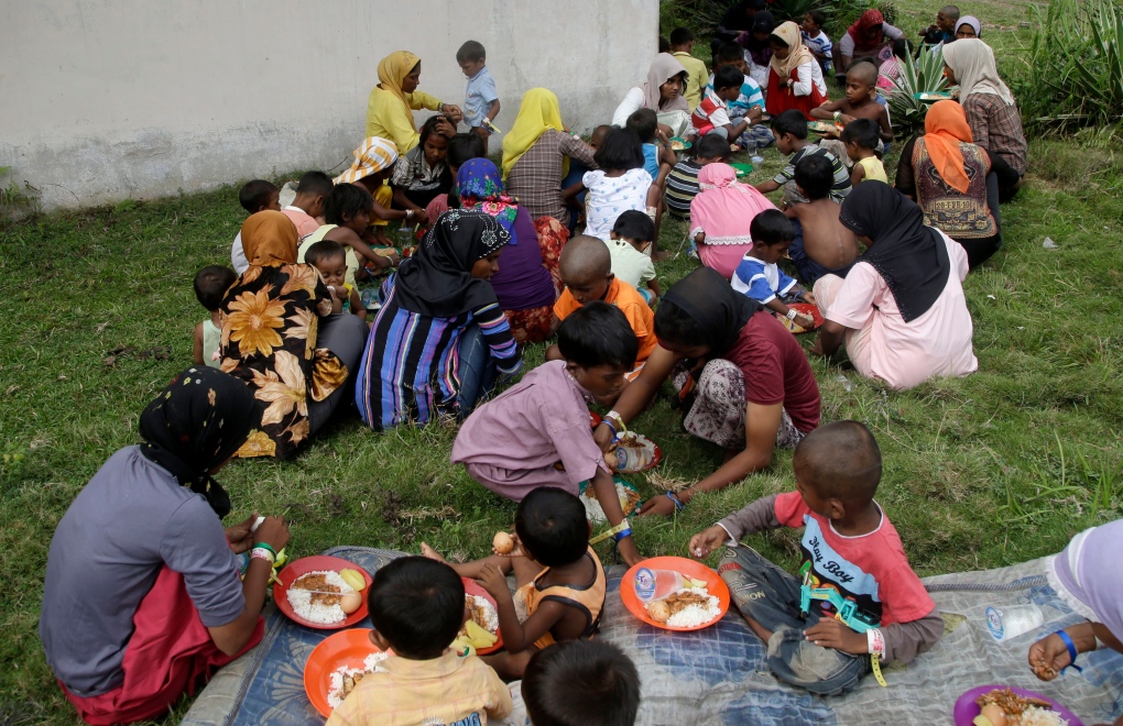 Ethnic Rohingya women, kids at shelter