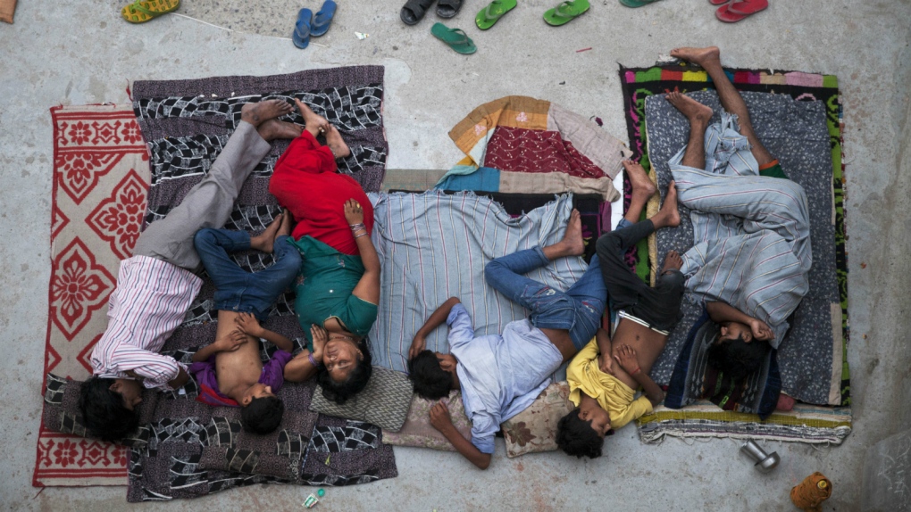 Family sleeping duing India heat wave