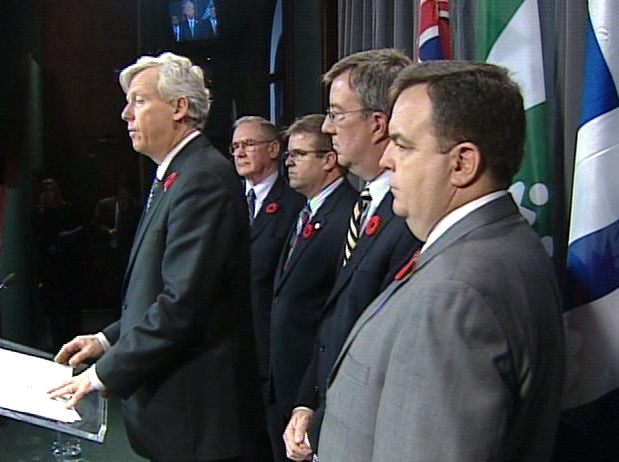 Toronto Mayor David Miller is joined on stage by Ontario Minister of Municipal Affairs and Housing Jim Watson and Minister of Finance Dwight Duncan during a press conference at Queen's Park in Toronto, Friday, Oct. 31, 2008.