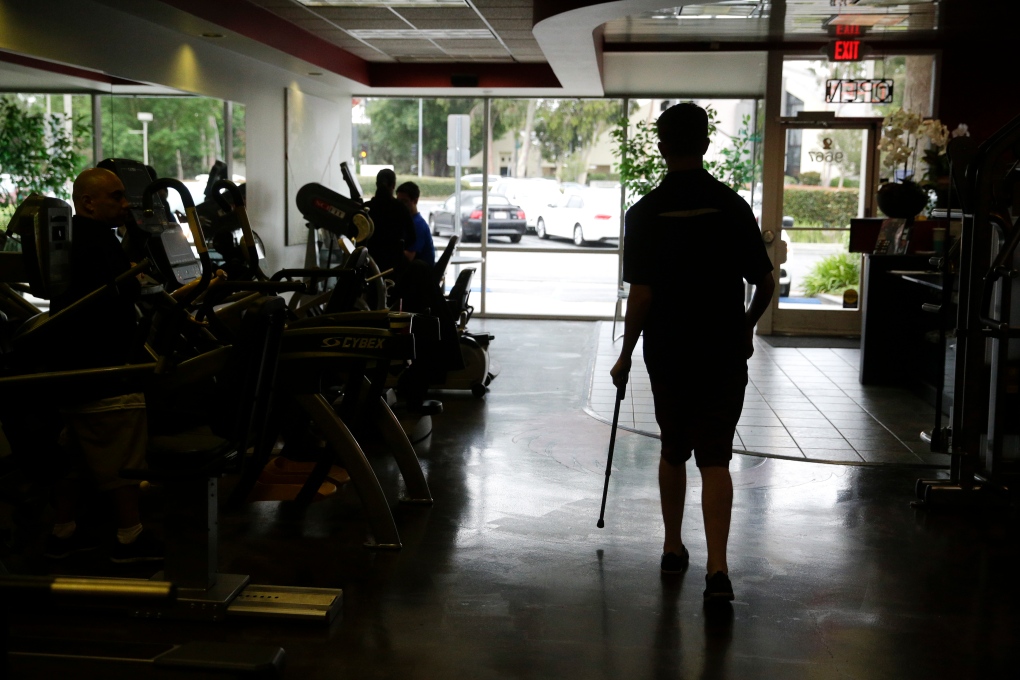 Parlyzed Aaron Baker learns to walk again